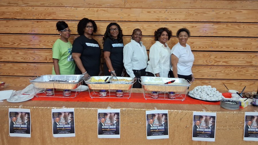 First Victory Cathedral Outreach Ministry team serving hot meals to the Tampa community